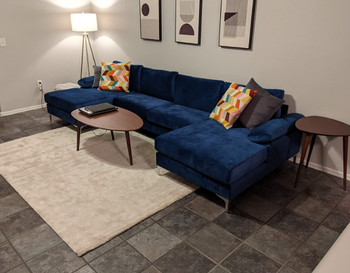 reviewer image of sofa in blue in living room
