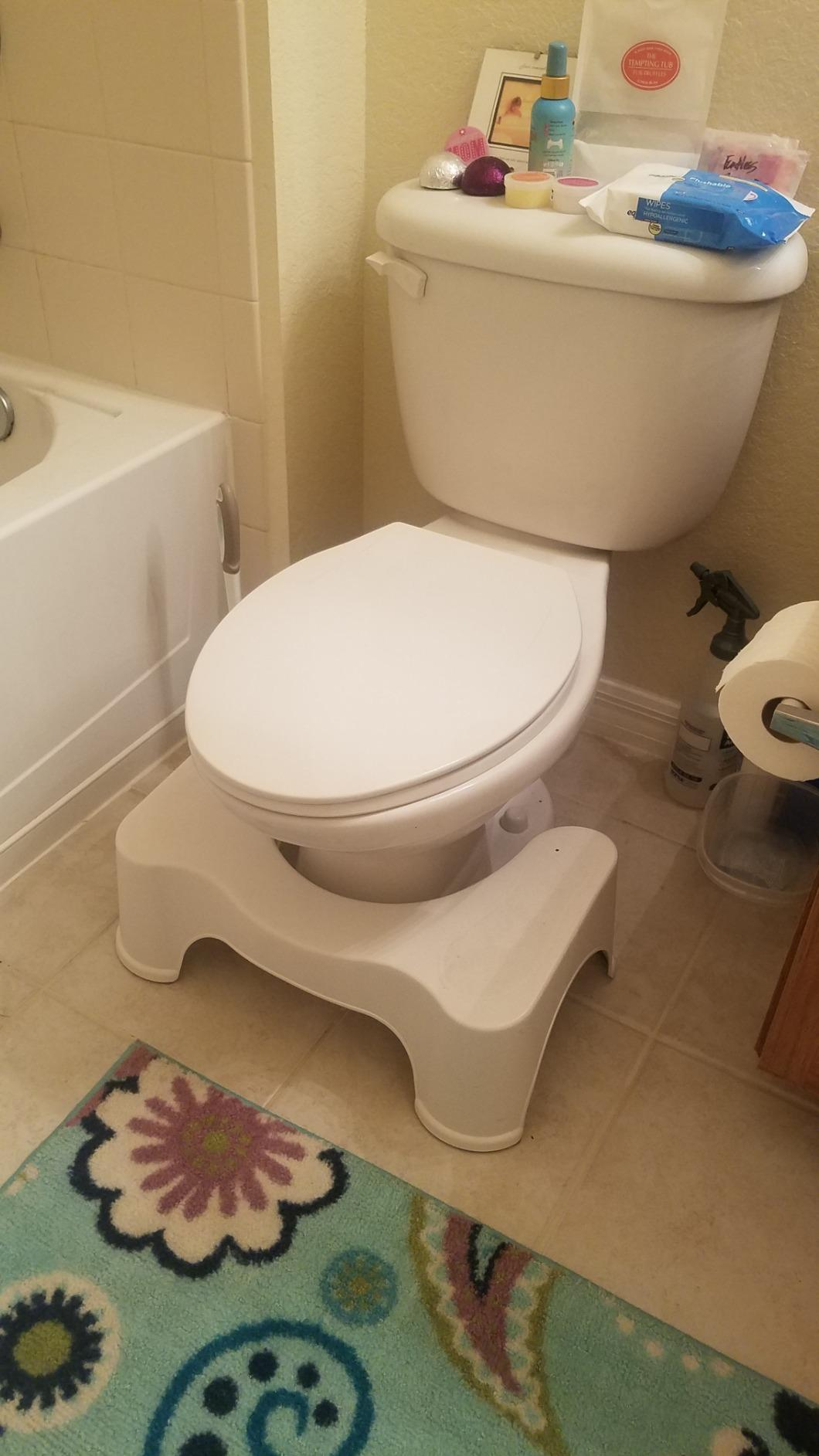 a reviewer photo of the Squatty Potty in front of a toilet 
