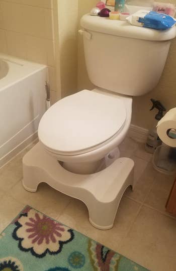 a reviewer photo of the Squatty Potty in front of a toilet 
