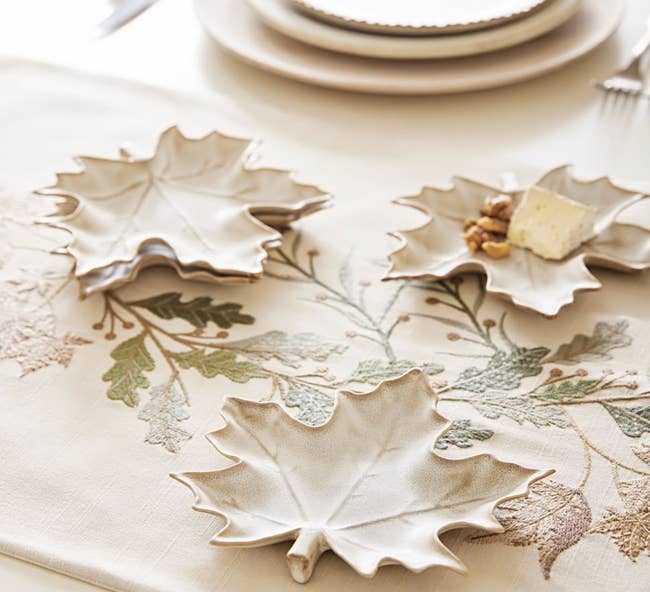 set of maple leaf plates on fall tablescape