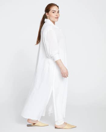 person in a white tunic and trousers