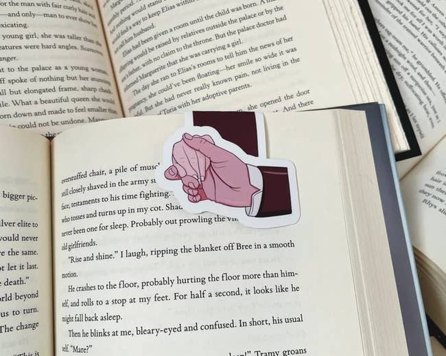 a magnetic bookmark that looks like Elizabeth Bennett and Mr. Darcy's holding hands