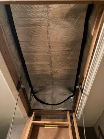 view of the insulation from the attic stairs