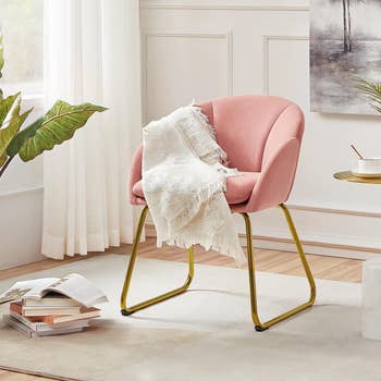 Modern pink accent chair with gold legs 
