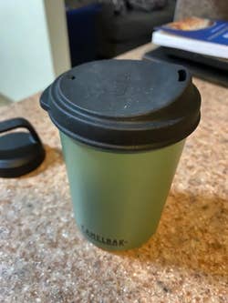 unfolded mug lid on detached cup bottom