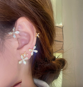 Model wearing it on their ear 