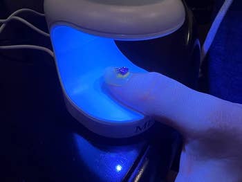 reviewer photo curing nail under lamp
