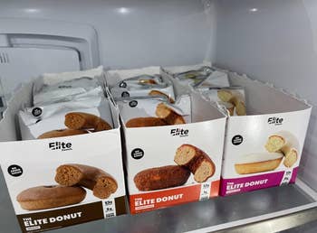 Reviewer image of all three donut flavors in boxes in the fridge 