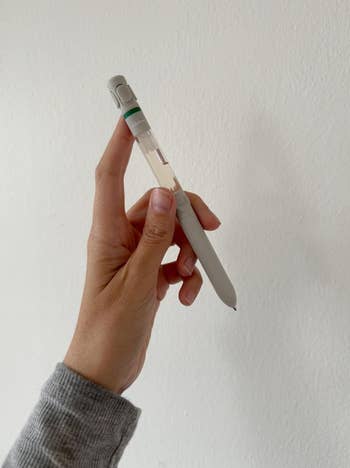 Social media trends Viral content Trending hashtags Social media updates Trending memes and videos A hand holds a sleek, multi-function pen against a plain background