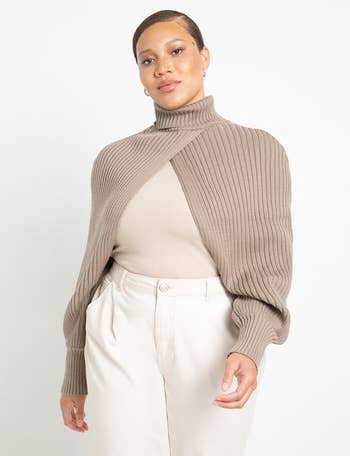 model wearing brown/beige sweater