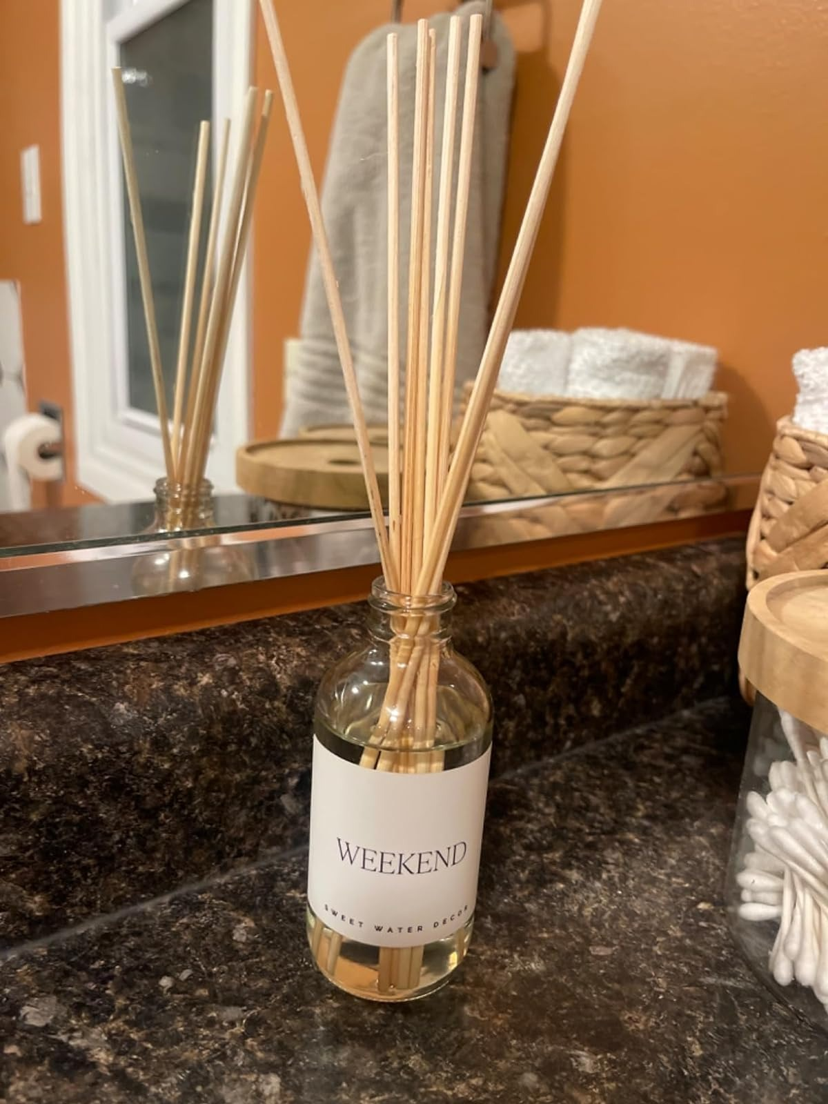 Reed diffuser labeled 