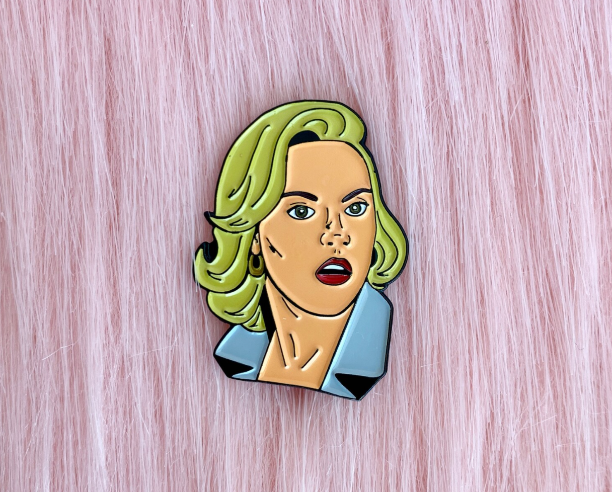 an enamel pin of meredith blake from the parent trap 