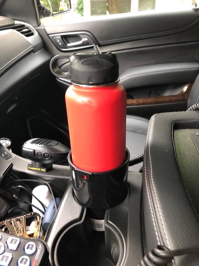 reviewer's hydroflask in the larger cup that fits inside car cup holder