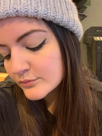 reviewer showing their perfectly winged eyeliner
