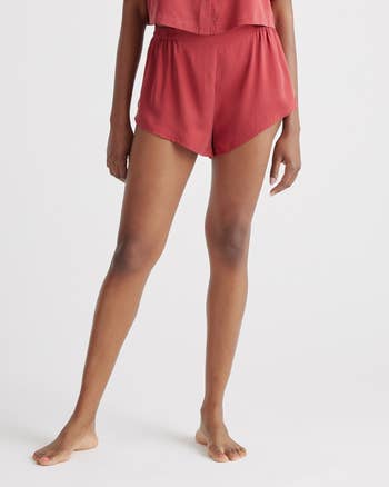 Person modeling satin slumber  shorts with a relaxed fit