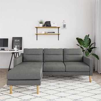 a small gray sectional sofa