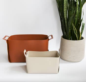 two faux leather storage baskets