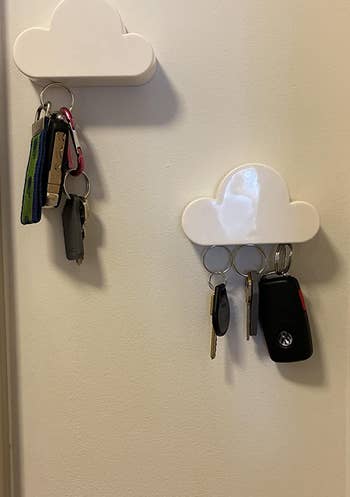 two of the little clouds hung at an angle, holding two different sets of keys
