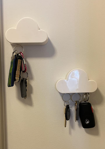 two of the little clouds hung at an angle, holding two different sets of keys