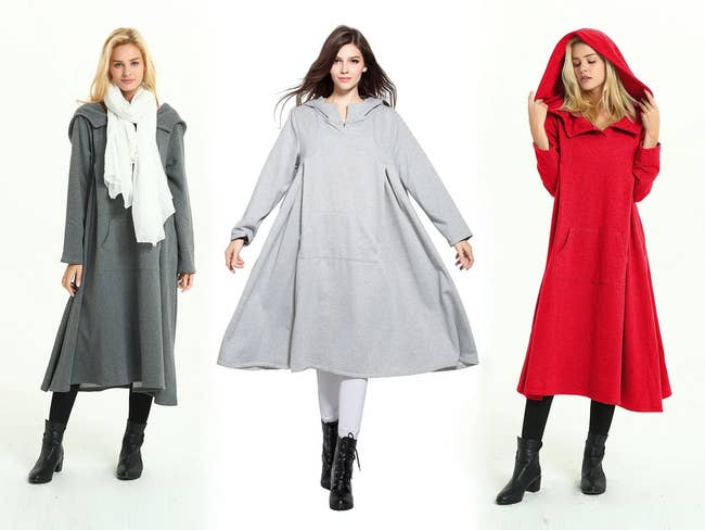three models wearing the hooded dresses in dark gray, light gray, and red