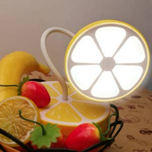 lemon style lamp turned on with adjustable neck