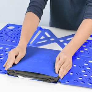 hands using blue folding board
