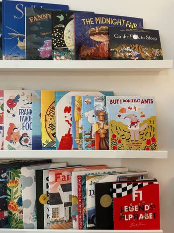 Shelves stocked with various children's books