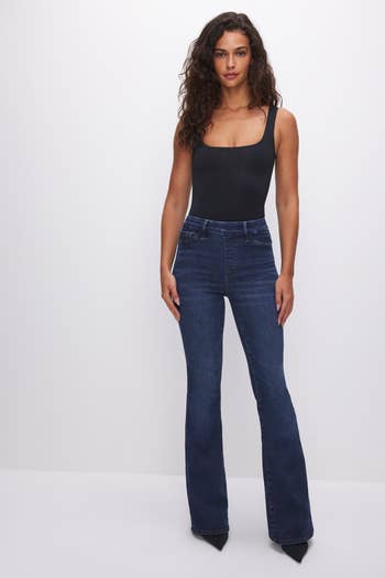 model wearing darker jeans