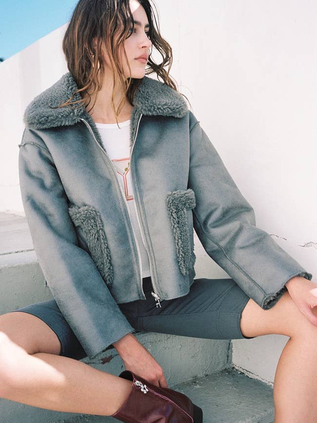 a gray moto coat lined with shearling