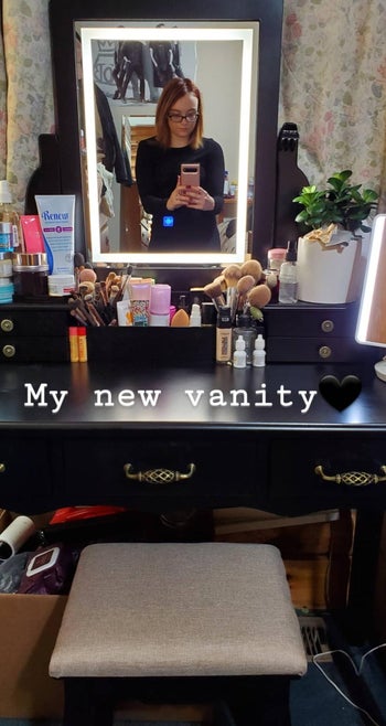 reviewer mirror selfie in the vanity with Instagram story caption, 