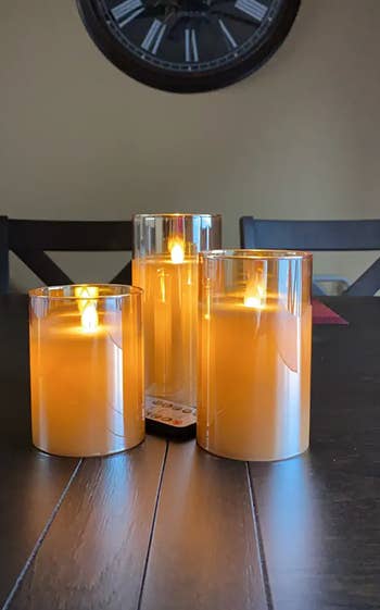 reviewer image of three flameless candles grouped together on tabletop