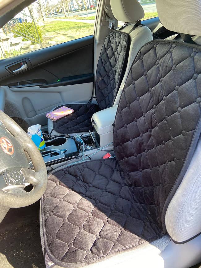 A reviewer's car seats with the heated seat covers