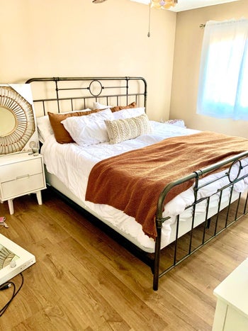 bronze hued bed frame in reviewer's home