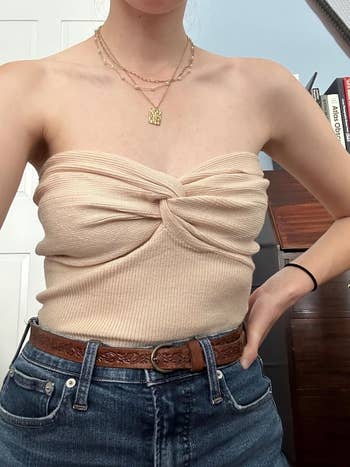 reviewer wearing the top in beige