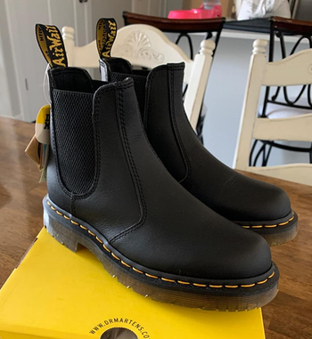 Reviewer image of black boots on yellow box