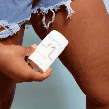gif of model applying the stick to their inner thigh