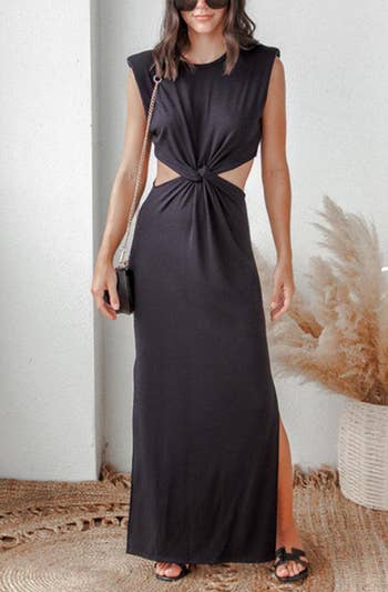a model wearing the dress in black