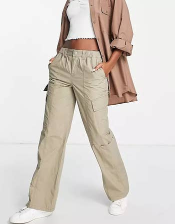 a model wearing the khaki cargo pants