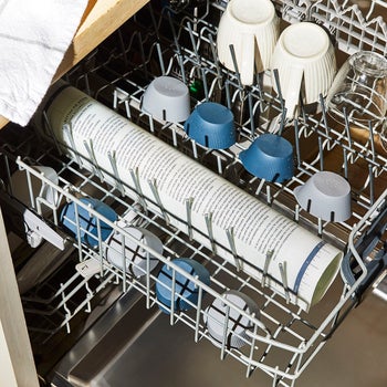 the rolled up pastry mat in the dishwasher