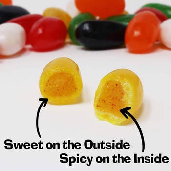 a jelly bean cut in half to show the spices on the inside 