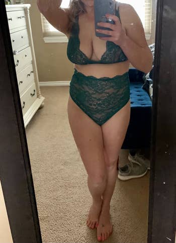 Person taking a reflector selfie wearing lace lingerie successful a chamber mounting with disposable dresser and shoes successful the background