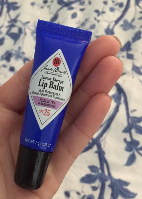 another reviewer image holding tube of blackberry lip balm