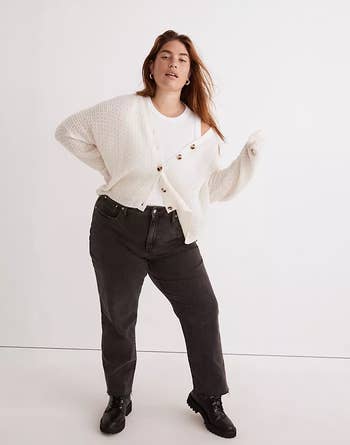 model wearing the cream cardigan over a white tank with black jeans