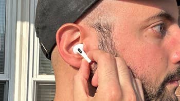 reviewer with AirPod in their ear