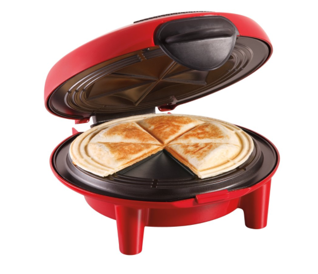 A red quesadilla maker with quesadillas in the middle