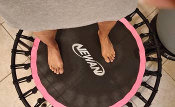 another reviewer standing on their pink trampoline