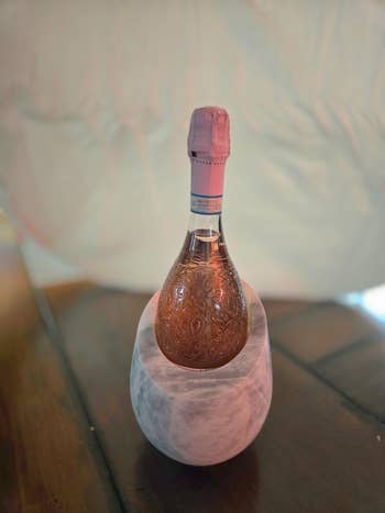 Decorative vino  vessel  successful  an elegant marble holder connected  a woody  table, suitable for gifting oregon  luxury location  decor