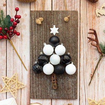 black and white ornaments in the shape of a tree