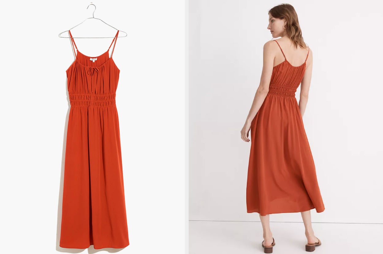 Orange maxi silk dress with ruched waist and scoop neckline with tie on a white background, model showing back view of dress with spaghetti straps