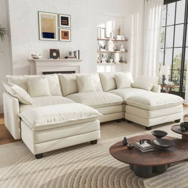 Spacious achromatic sectional sofa successful a modern surviving country with a woody java array and partition art, creating a cozy, stylish atmosphere